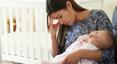 sad mother holding baby