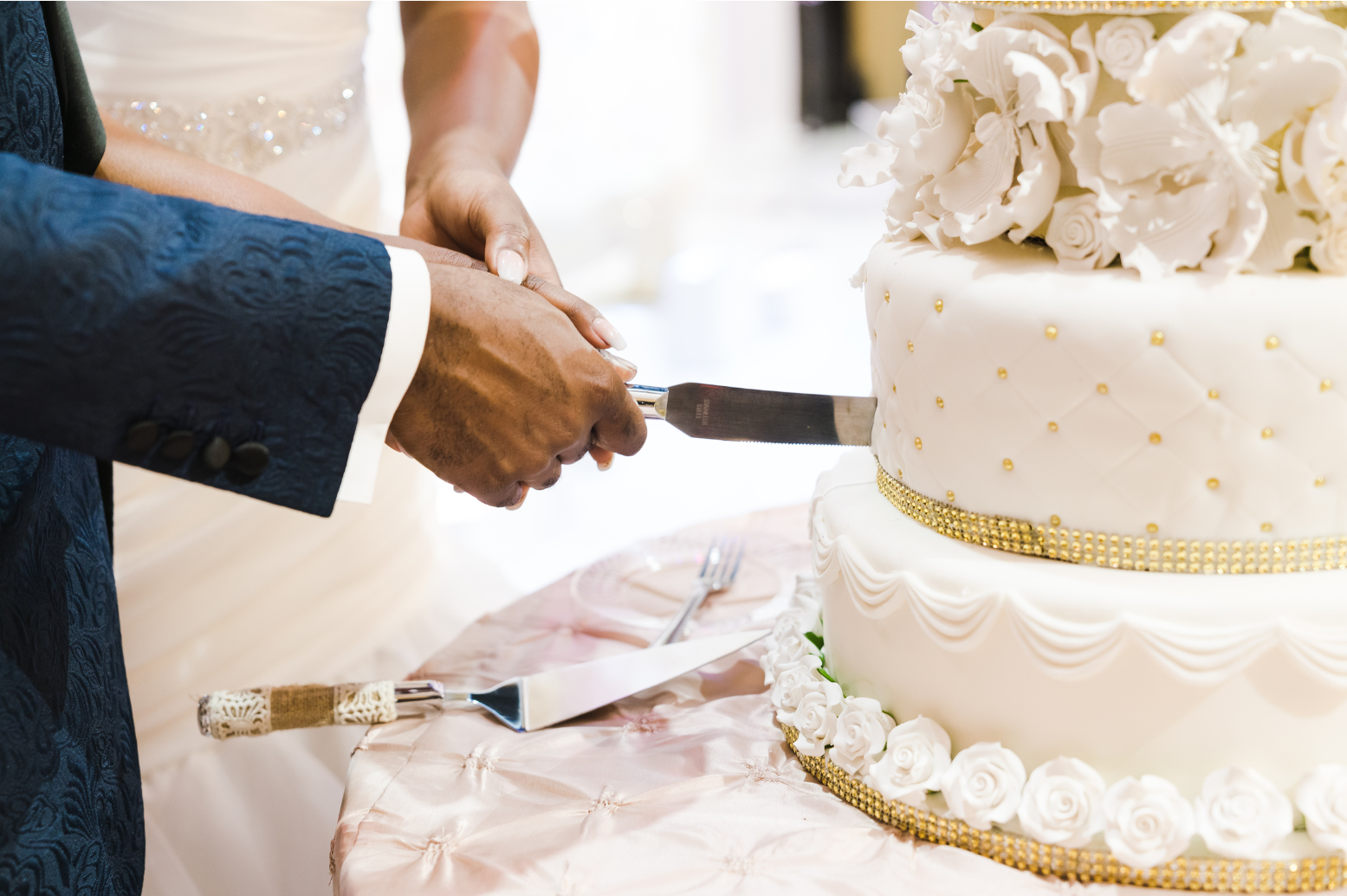 couple cutting wedding cake together